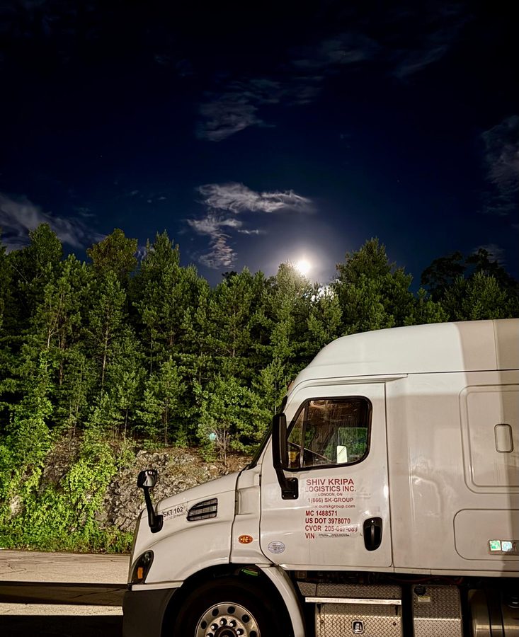 Shiv Kripa Logistics sleeper tractor, unit SKT 102, at night