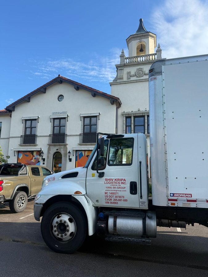 Shiv Kripa Logistics straight truck, unit SKT136, on a delivery