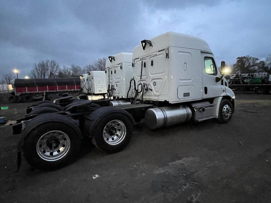 Fleet of sleeper tractors parked in the yard